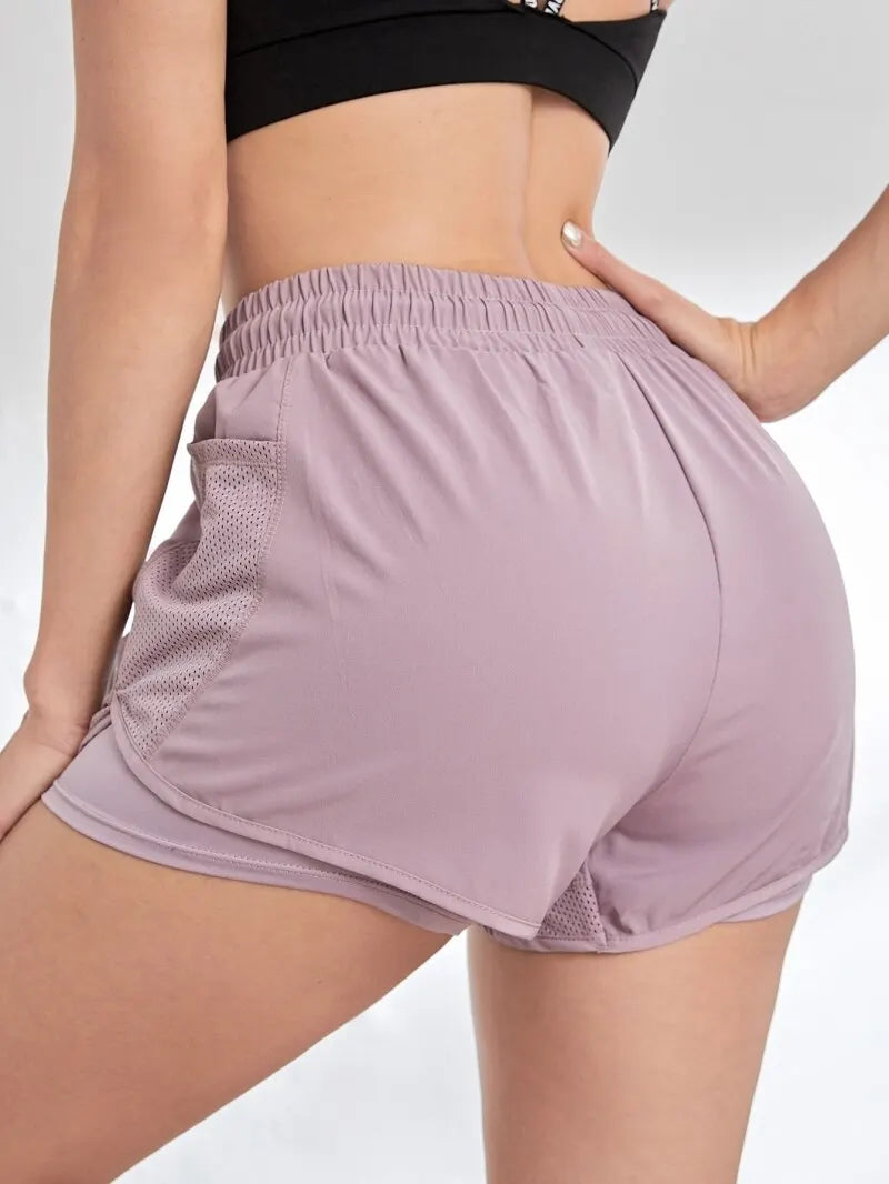 Short de sport élastique pour femme, short avec poches, faux legging de yoga deux pièces pour la course et l'entraînement