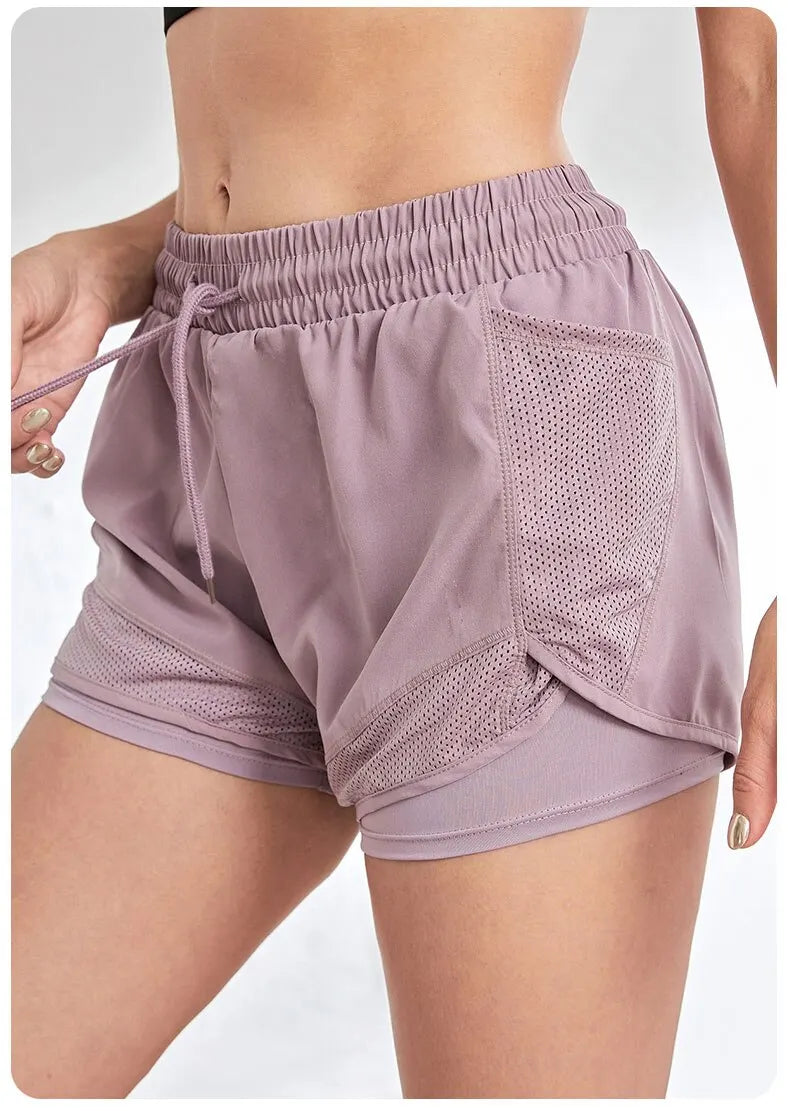 Short de sport élastique pour femme, short avec poches, faux legging de yoga deux pièces pour la course et l'entraînement